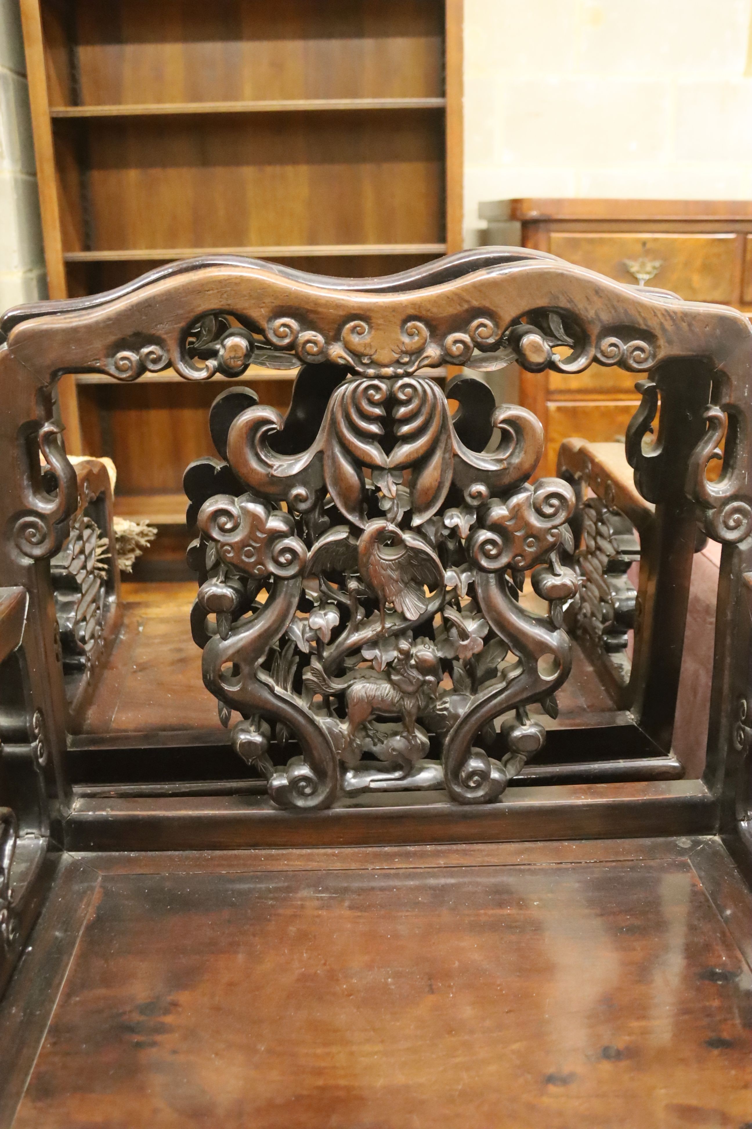 A pair of Chinese carved hongmu elbow chairs (a.f.), width 65cm, depth 48cm, height 96cm